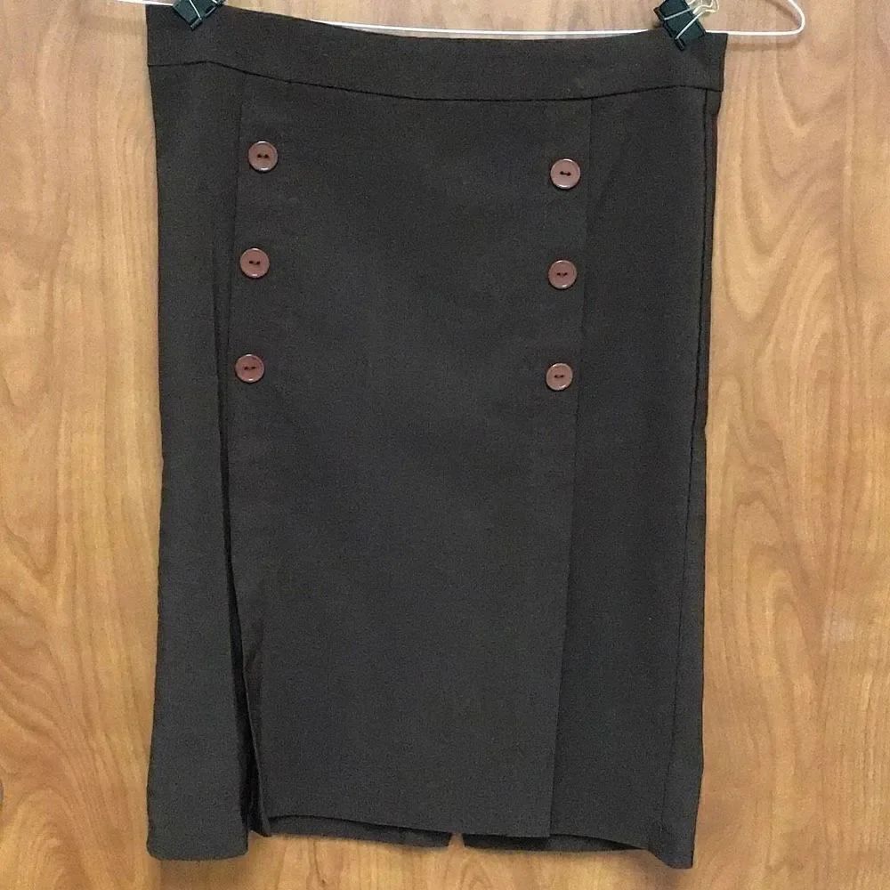 Skirt. Sexy brown skirt by Lola laying flat waist measures 16 I think that makes